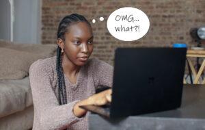 Photo shows a woman reacting to the price of an online article